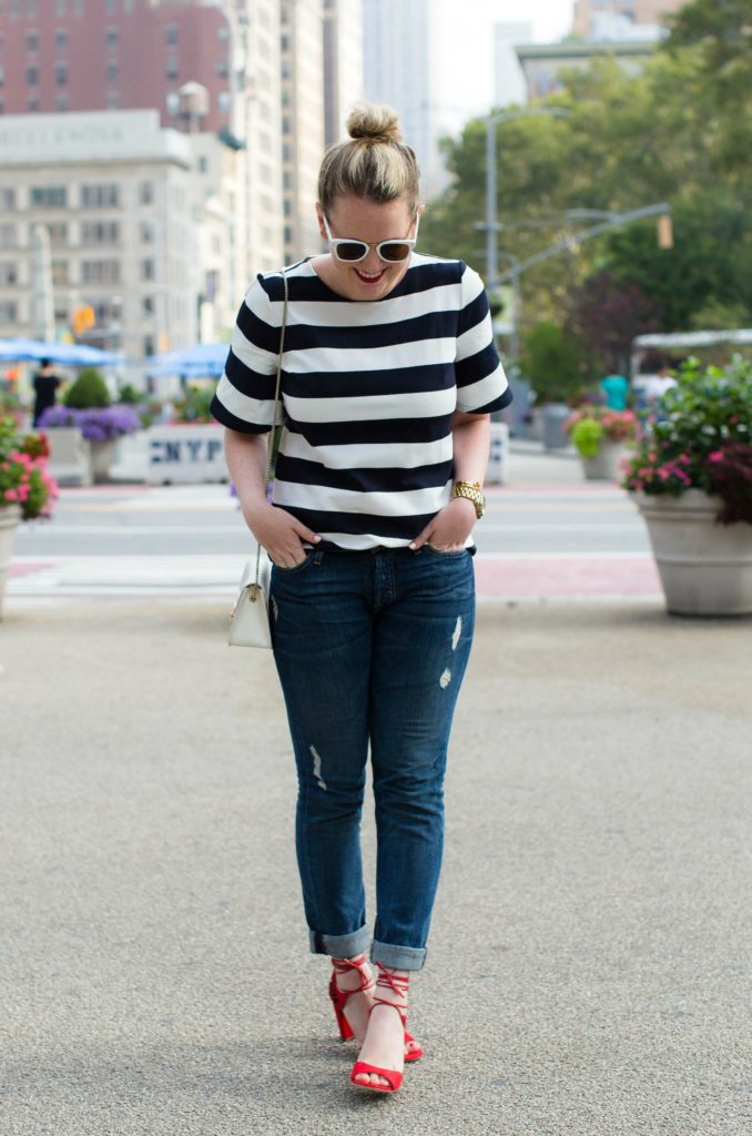 Meghan Donovan of wit & whimsy wears a striped tee with boyfriend jeans