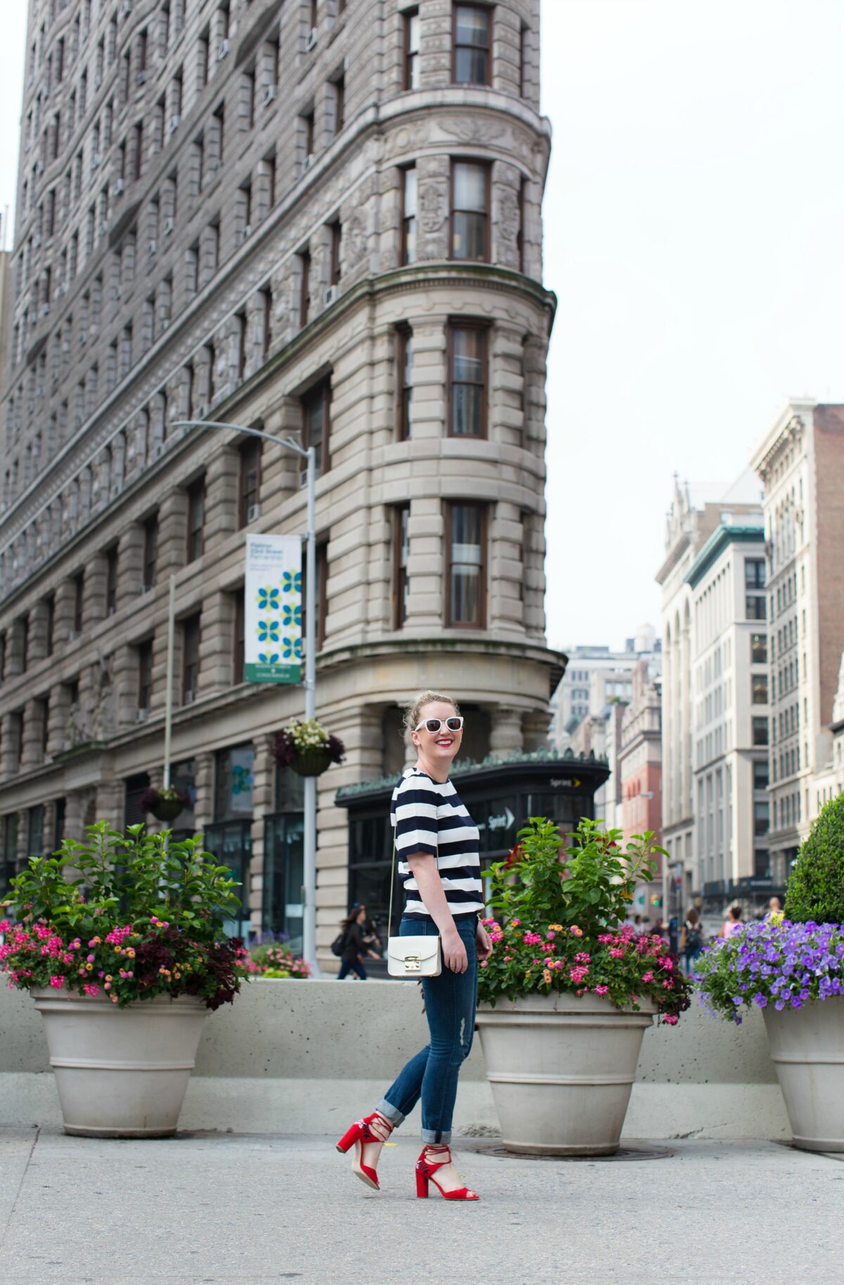 Meghan Donovan of wit & whimsy wears a striped tee with boyfriend jeans