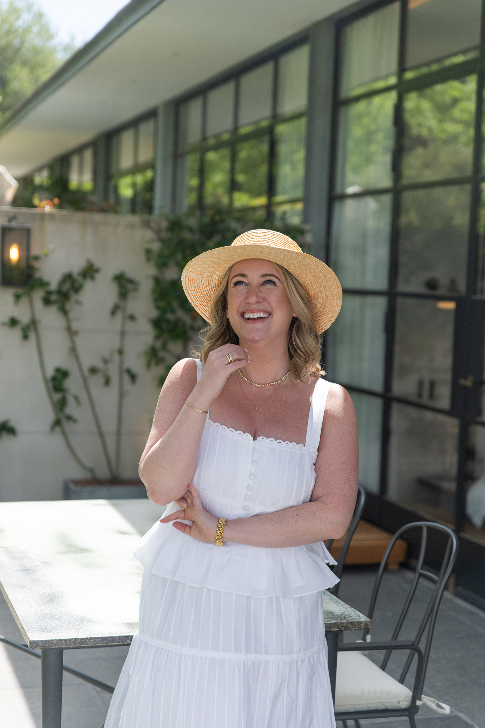 Meghan Donovan wearing a straw hat in the summer in Provence