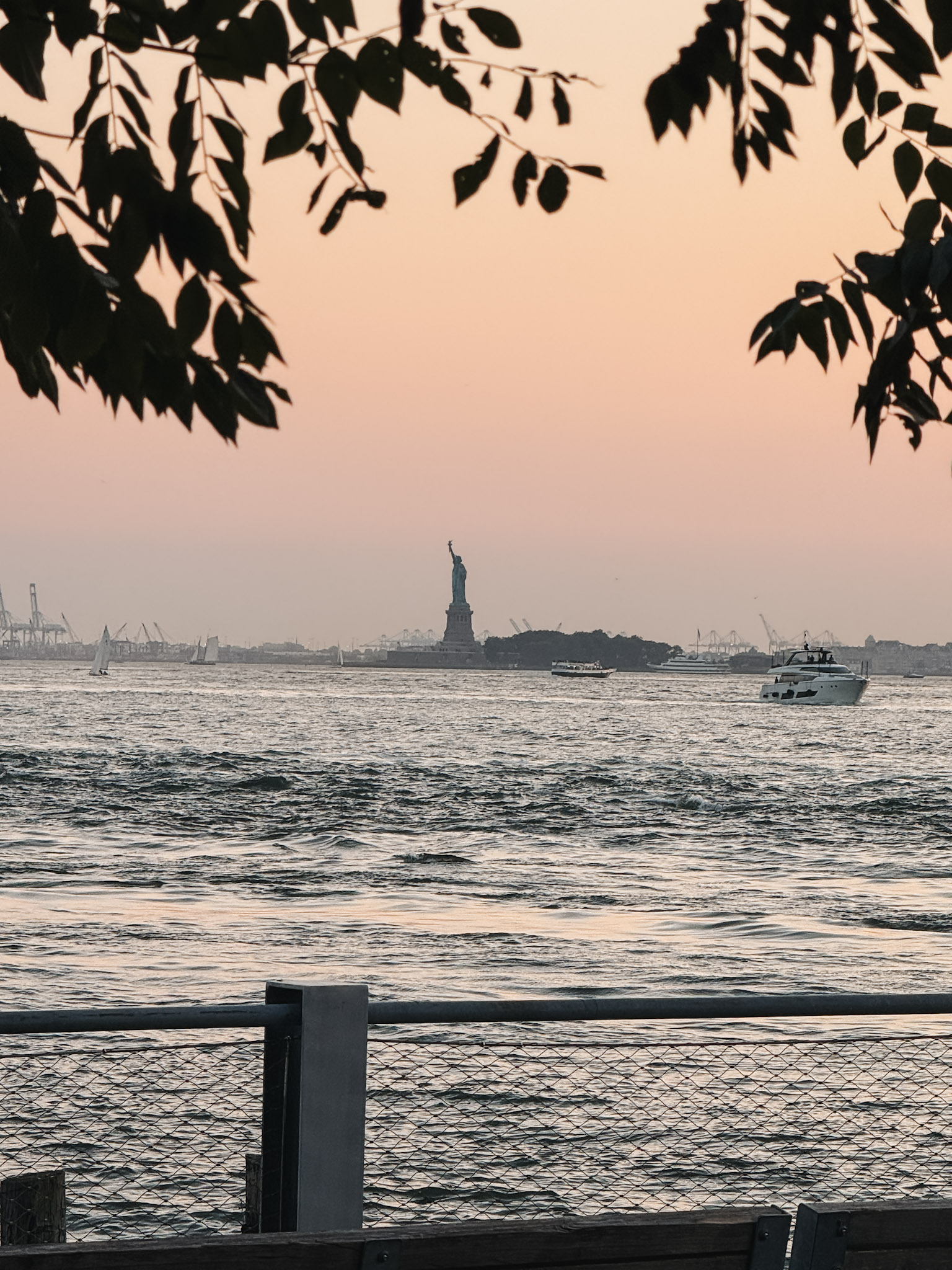 What to Do in Brooklyn Heights East River during sunset with a view of the Statue of Liberty