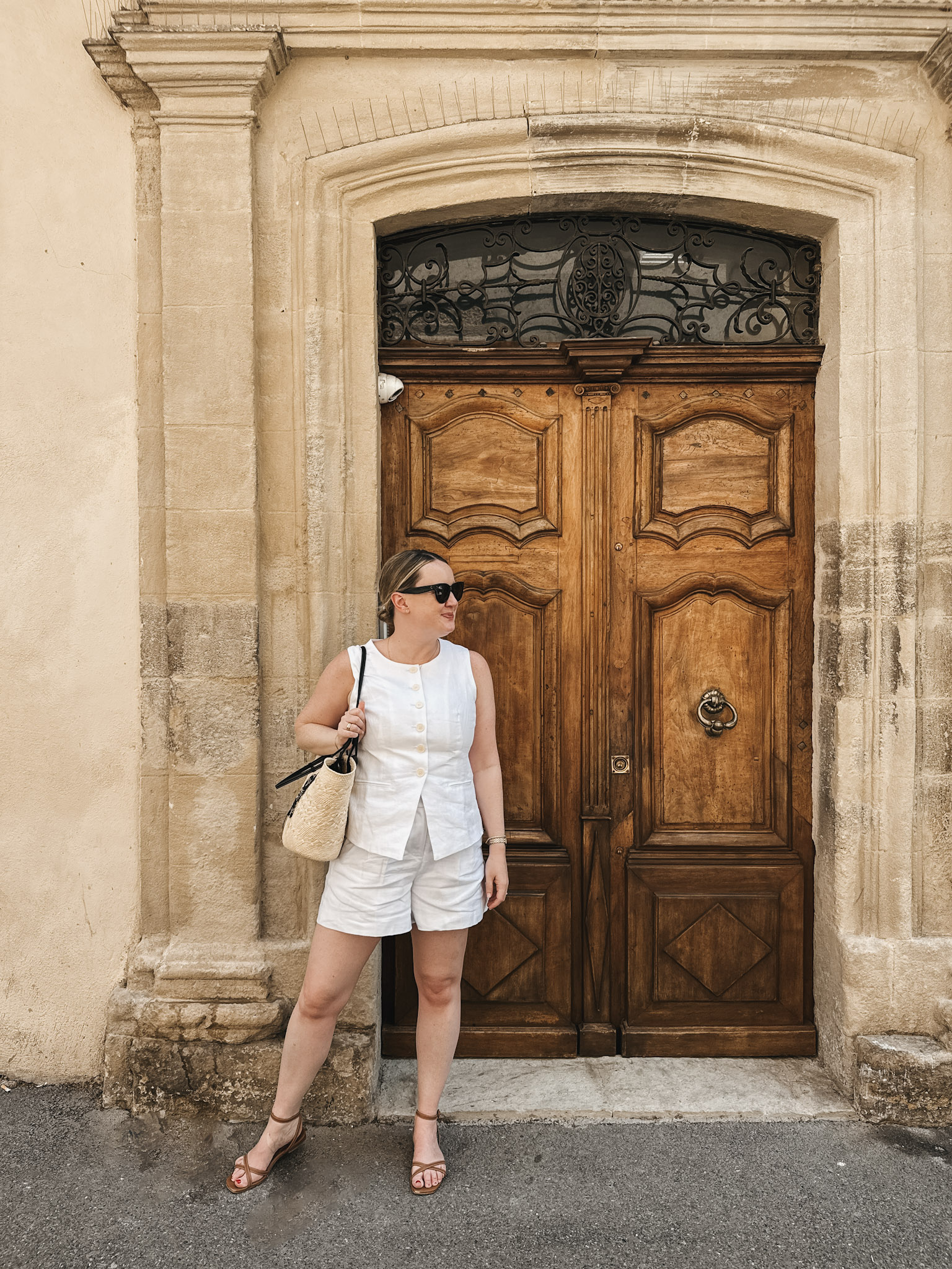 South of France Summer Packing List with & whimsy wearing a white matching set